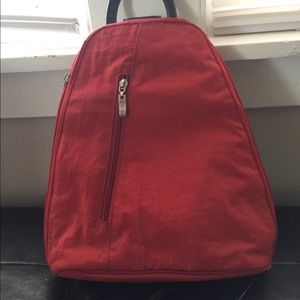 Baggallini Orange small sling backpack